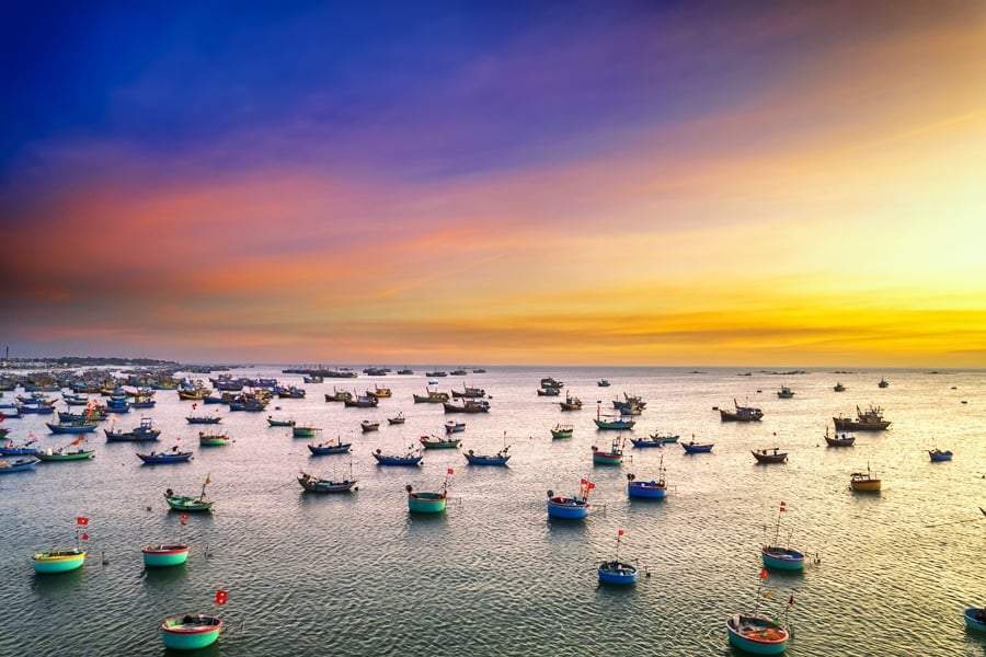 Sunset covers the fishing village Mui Ne Beach