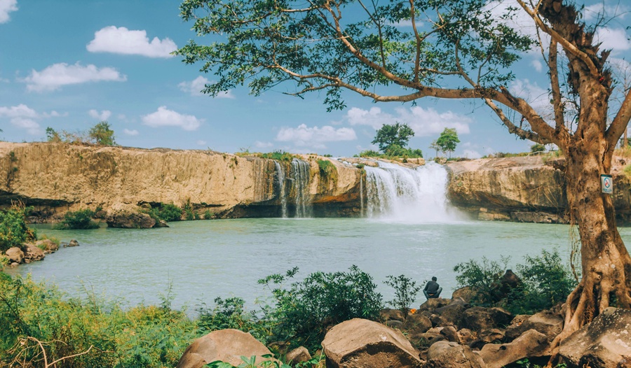 A stunning waterfall cascading through lush greenery in Buon Ma Thuot, Central Highlands, Vietnam.
