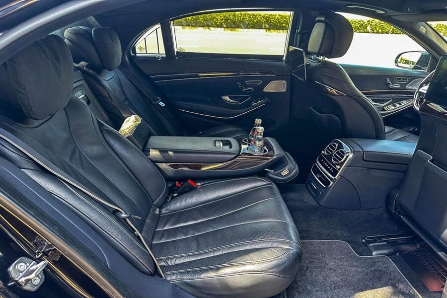 Luxurious interior of a black sedan with leather seats