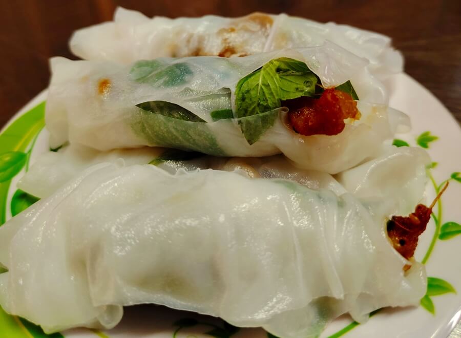 Fresh Vietnamese spring rolls with herbs and grilled pork