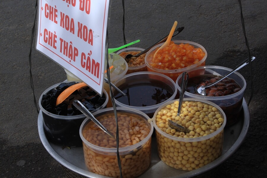 Many Vietnamese sweet soups served from a traditional street vendor