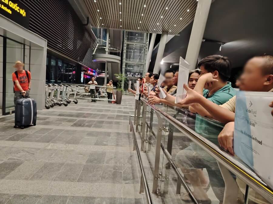 Drivers welcoming guests at an airport in Vietnam