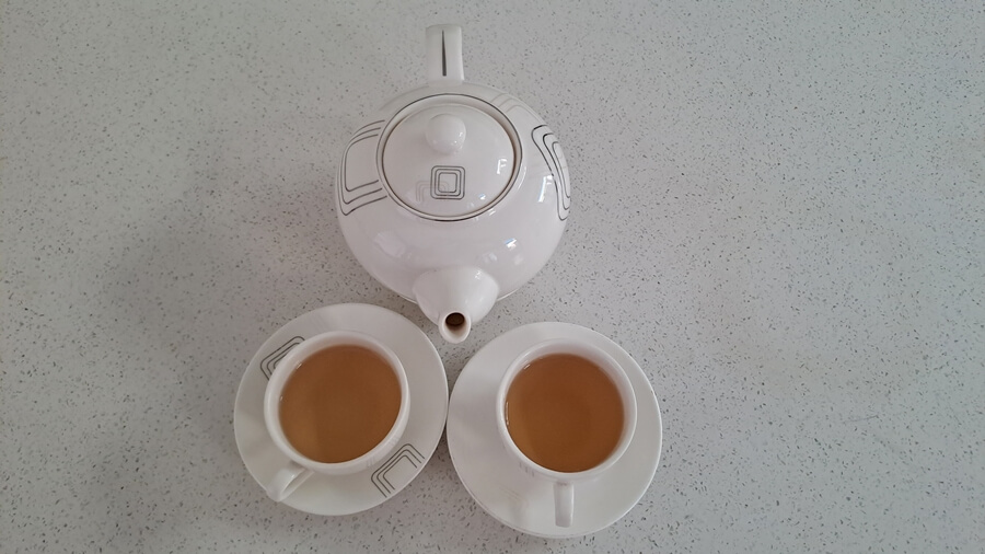 Vietnamese hot tea served in a pot with cups