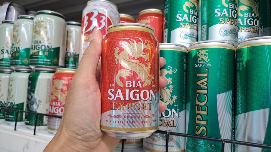 Saigon beer can standing out against the green and red cans