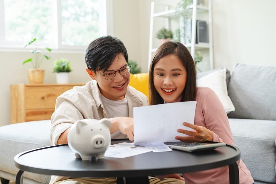 Couple reviewing expenses while planning a 2-week trip to Vietnam
