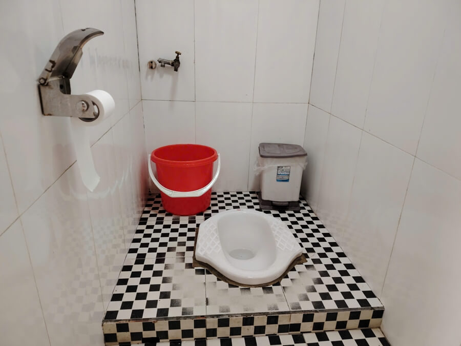 Asian squat toilet in a public restroom in Vietnam