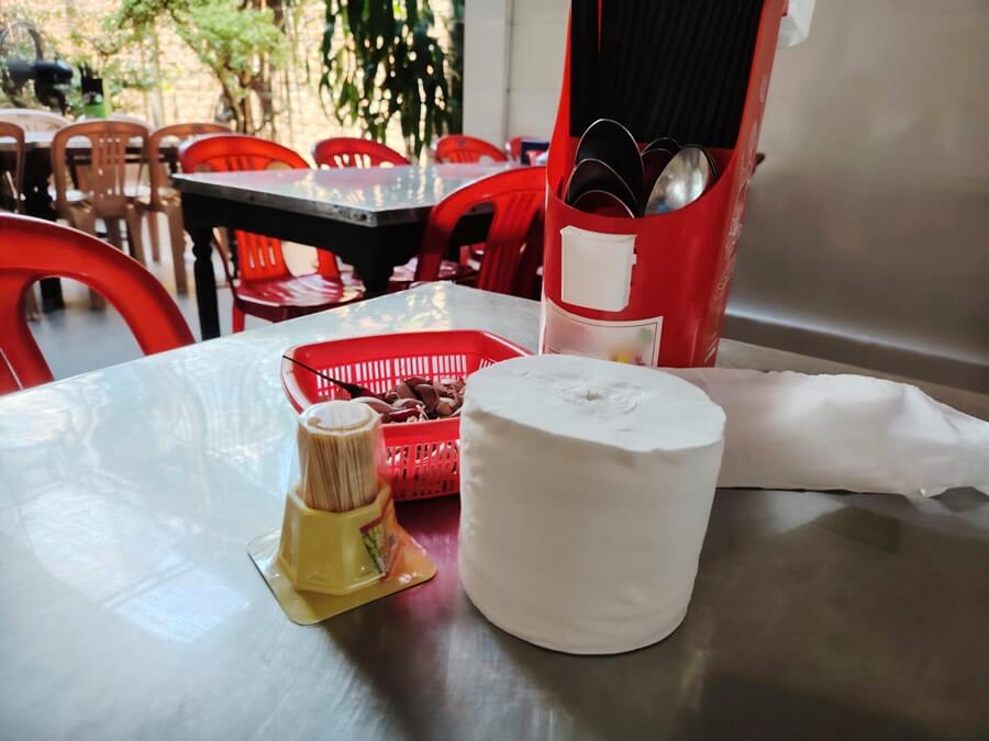 Toilet paper roll on a dining table at a local restaurant in Vietnam