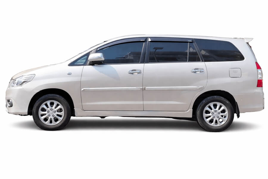 Silver Toyota Innova 7-seat SUV on white background