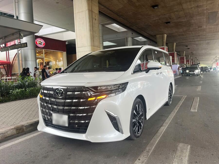 A premium car waiting at Ho Chi Minh City airport for passenger pickup