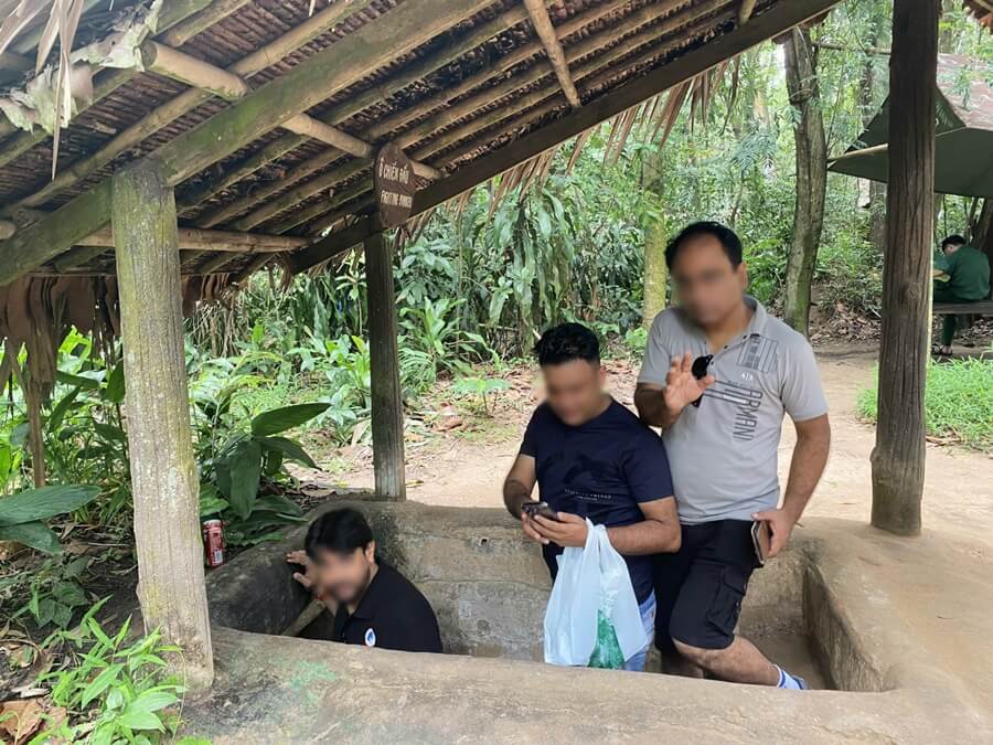 Our travelers entering a wider tunnel section at the Cu Chi historical area