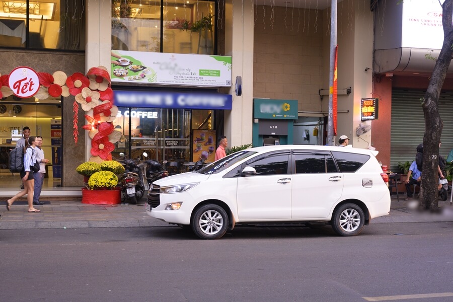 Private car waiting outside a hotel in Ho Chi Minh City before departure to Cat Tien National Park