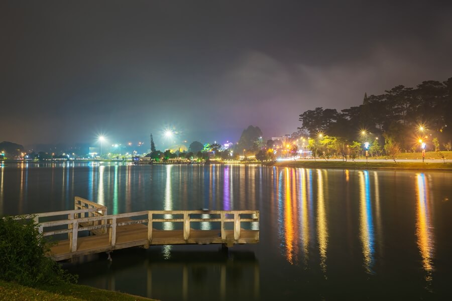 Evening lights reflecting on Xuan Huong Lake in Da Lat, Vietnam