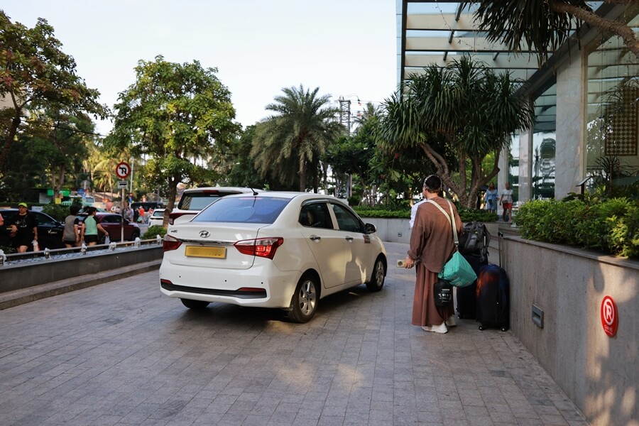 Private car dropping guests off at a hotel in Nha Trang after a two-day journey from Hoi An via Quy Nhon.
