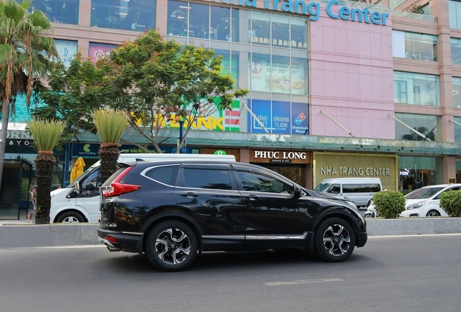 Private car with driver passing Nha Trang Center in Nha Trang