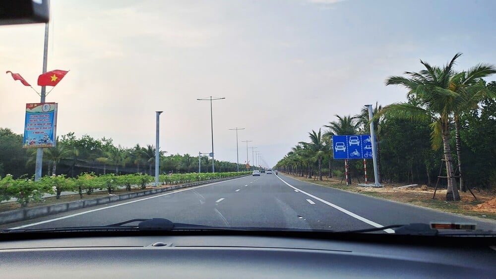 Bougainvillea-lined coastal road from Hoi An to Nha Trang via Quy Nhon