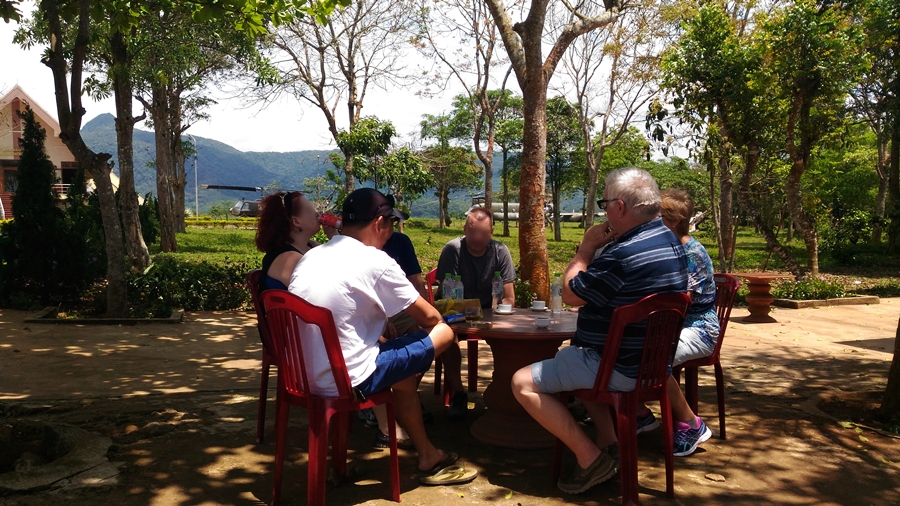 Travelers resting under the trees after visiting Ta Con Air Base in Khe Sanh