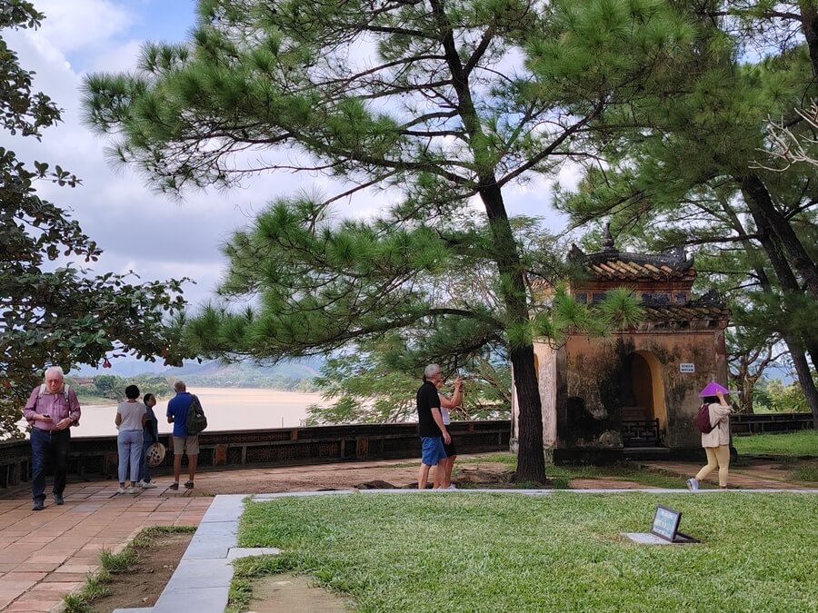 Visitors enjoying views of the Perfume River at Thien Mu Pagoda in Hue