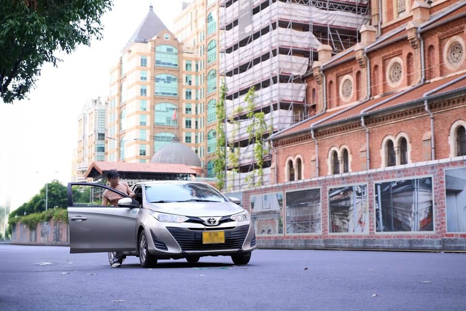 Private car stopped beside Notre Dame Cathedral in Ho Chi Minh City