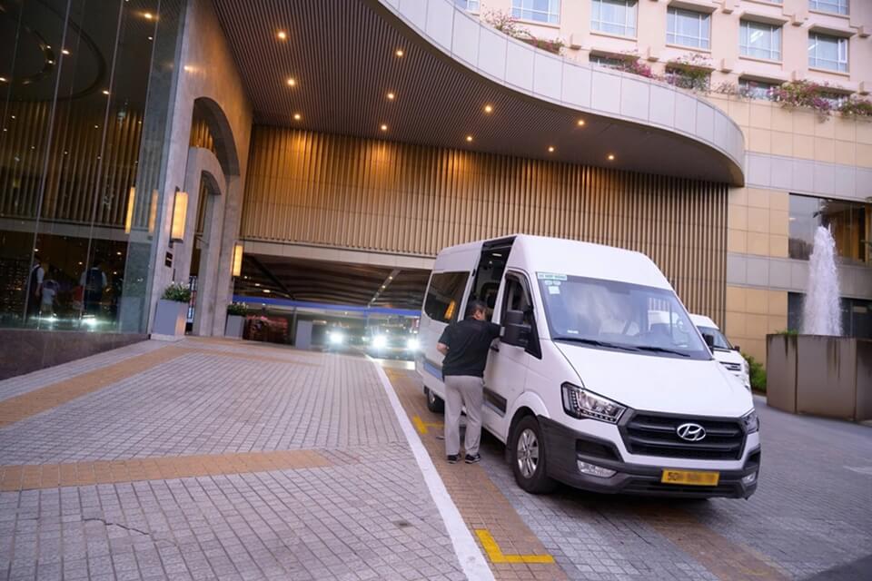 Private van dropping off guests at New World Saigon Hotel in Ho Chi Minh City