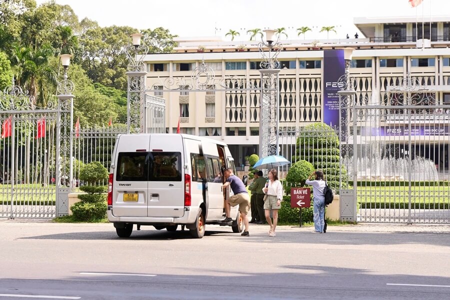 Guests boarding a private van at Independence Palace in Ho Chi Minh City