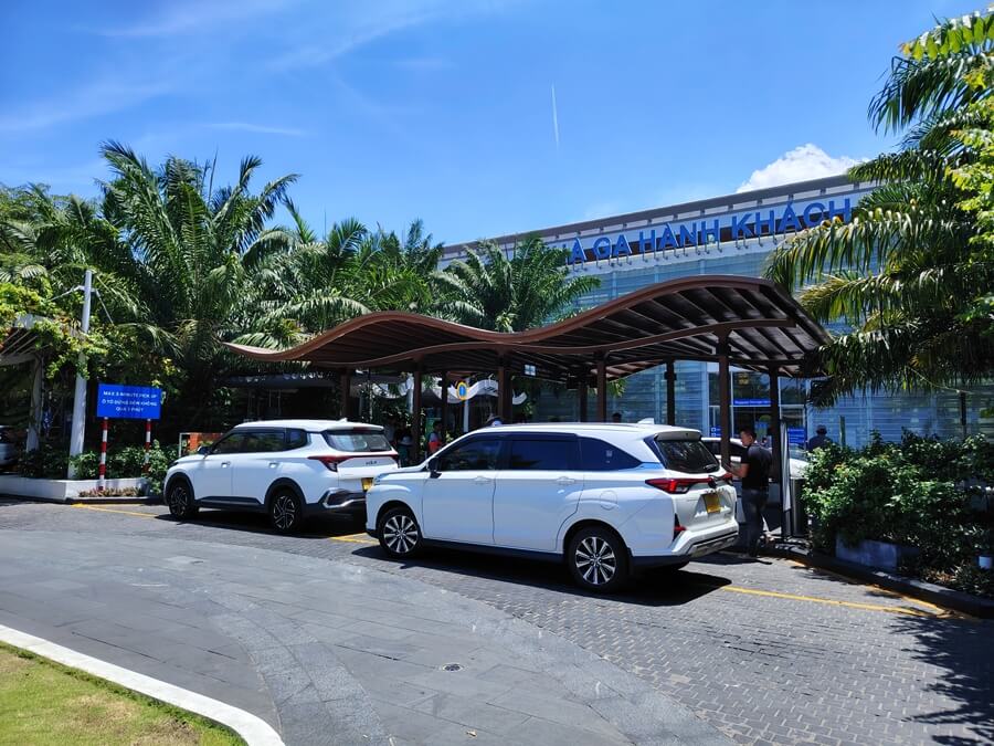 Private cars waiting for passengers at an airport for visiting factories in Vietnam