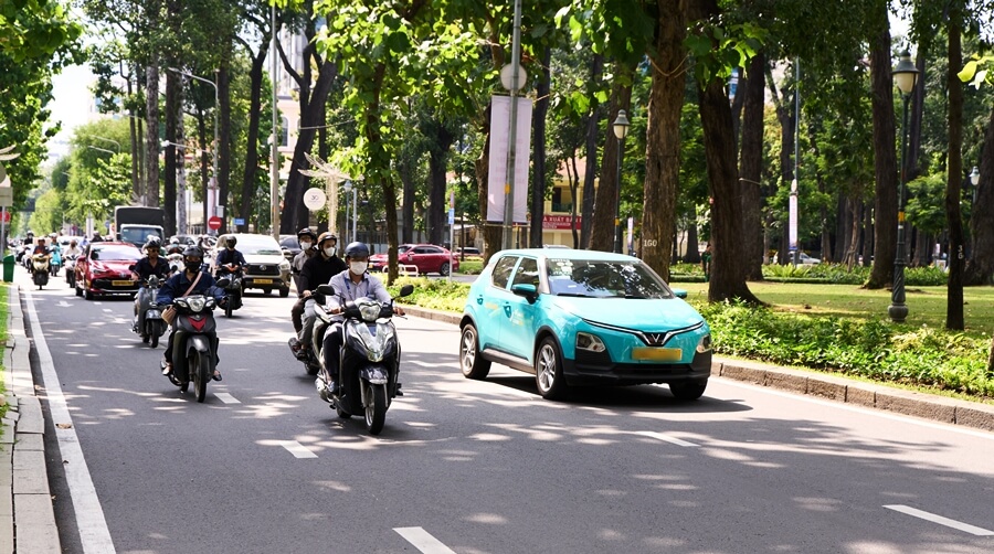 Busy road traffic in Ho Chi Minh City with cars and motorbikes