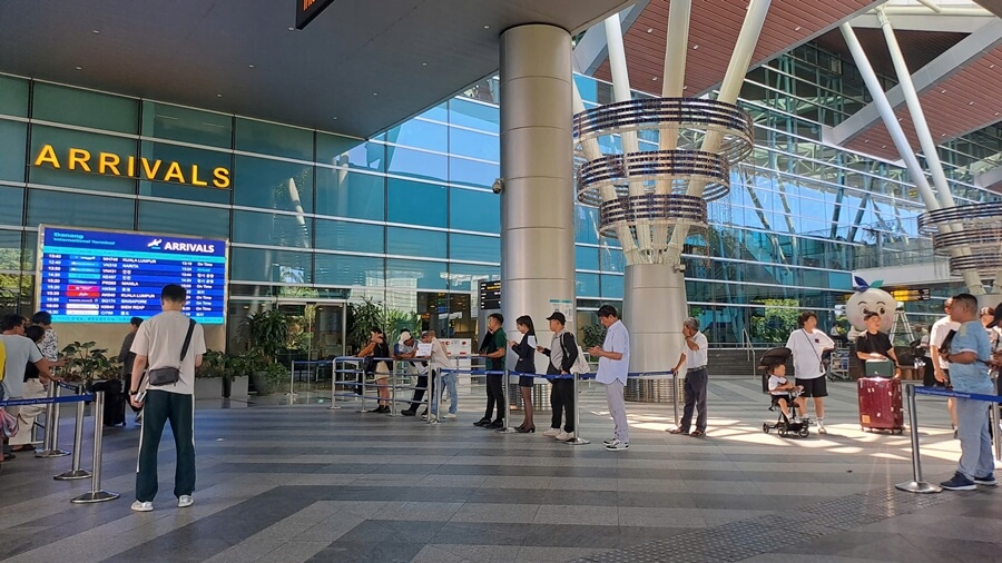 Private car driver meeting passengers at Da Nang Airport international arrival