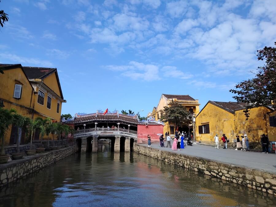 Japanese Covered Bridge surrounded by historic buildings in Hoi An Ancient Town