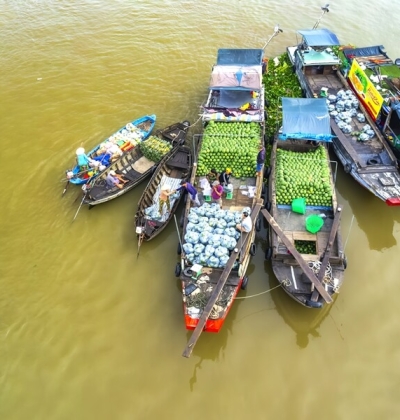 Floating market scene in Can Tho with fruit boats on the river