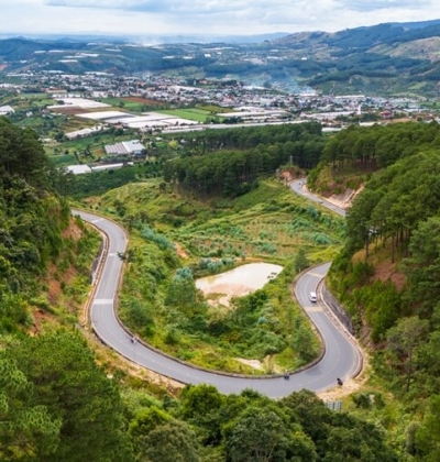 Private car driving on Ta Nung Pass along the Ho Chi Minh City to Da Lat route