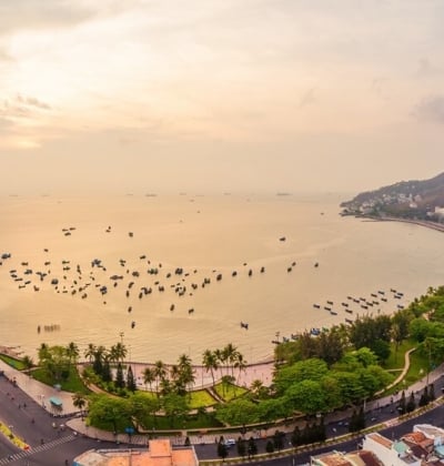 A corner of Vung Tau beach under golden sunlight