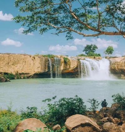 A stunning waterfall cascading through lush greenery in Buon Ma Thuot, Central Highlands, Vietnam.